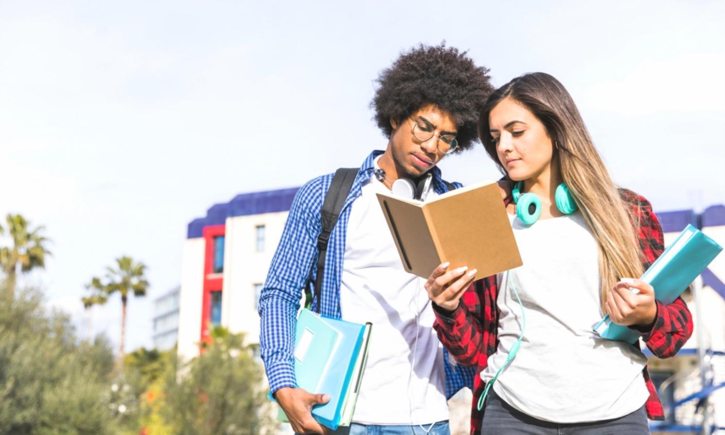Senior analyst mentoring junior team member during valuation review